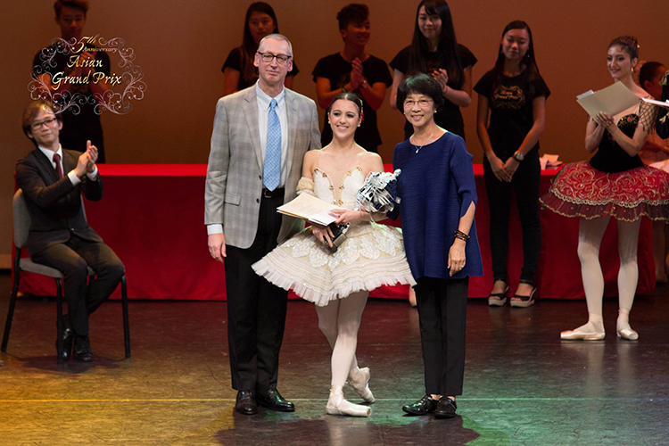 Ballet Manila company artist Katherine Barkman receives the coveted 2015 Asian Grand Prix award from jury president Garry Trinder and jury member Zhao Yu Heng Seated at le