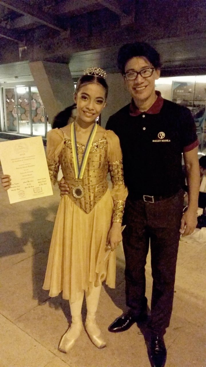 Neeka emerged as the silver medalist at the 2015 Asian Grand Prix in Hong Kong. Celebrating with her outside the Y-Theater is her uncle and mentor, Osias Barroso, who trained her and the other BM delegates for the competition.