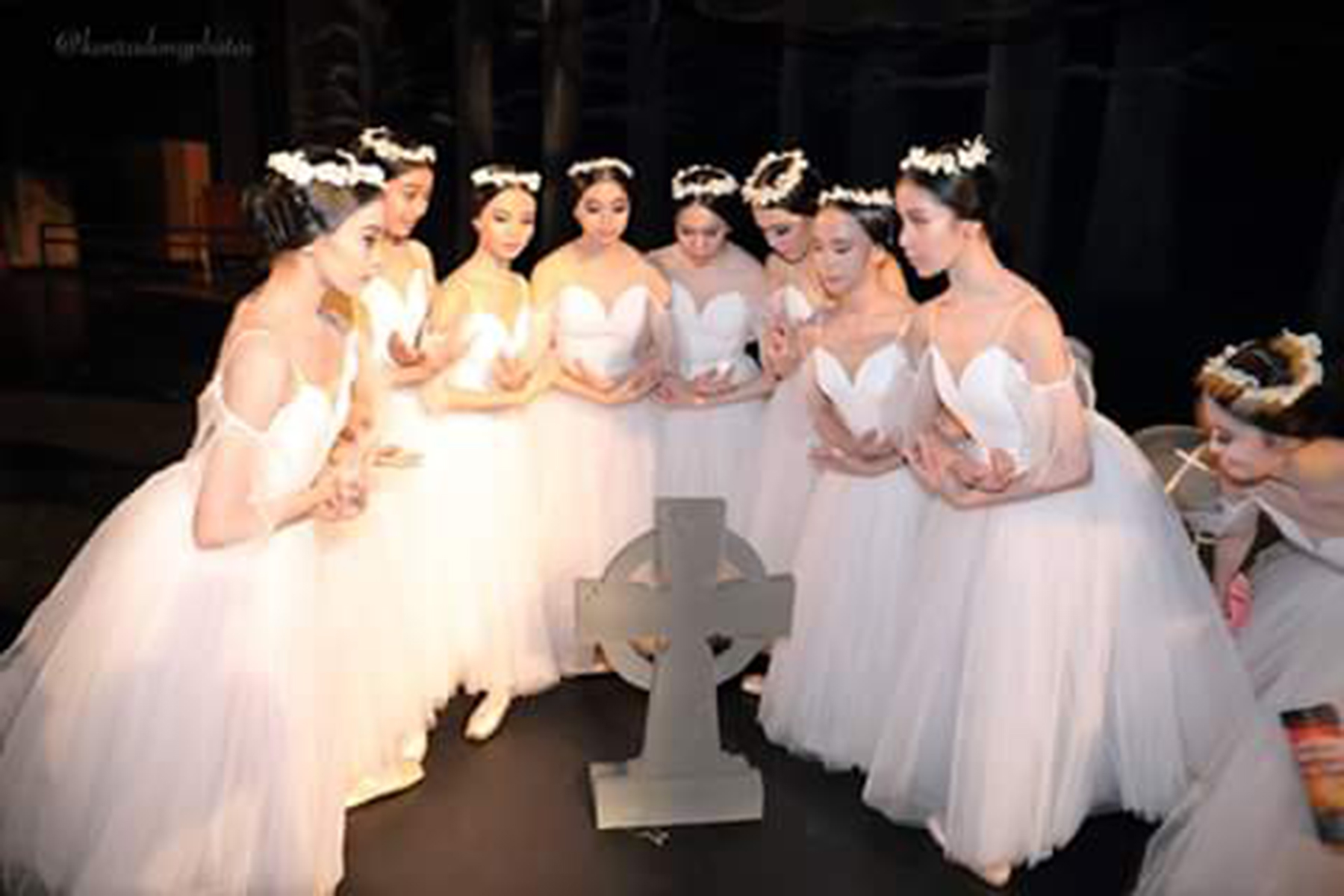 The wilis have a post-Giselle photo taken with an iconic prop. Photo by Konrad Ong