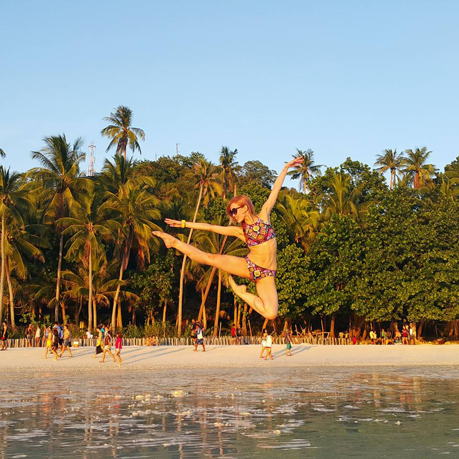 While on summer vacation in Boracay, Joan executes a fantastic jump/ dance shot.